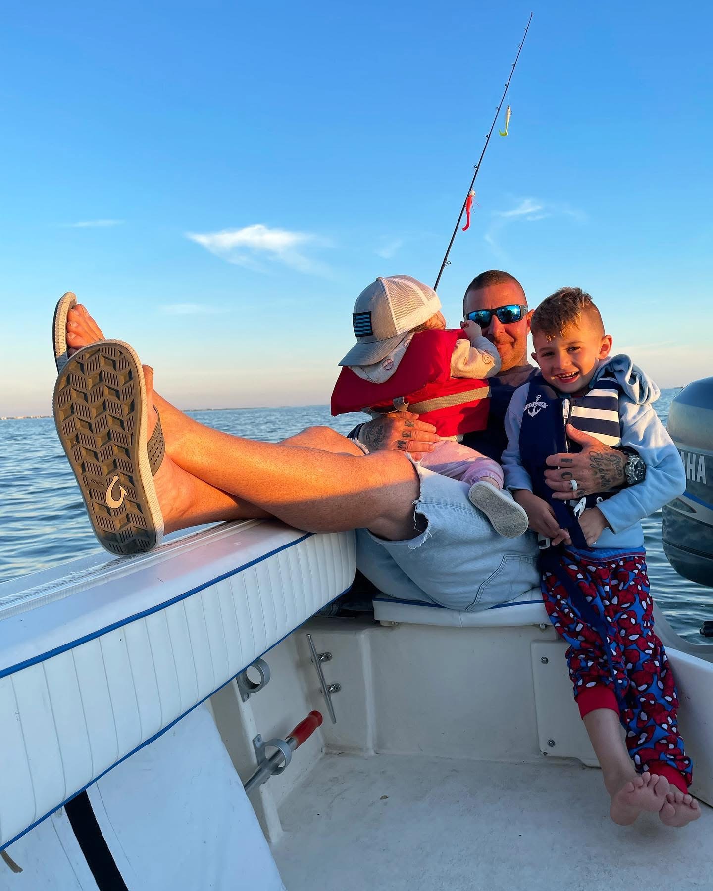 Craig fishing on the bay with his kids